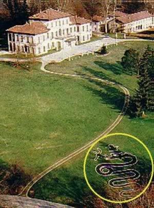 Sylvio Berlusconi’s front lawn with man-eating serpent symbol.